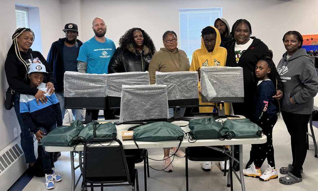 group of students and families receiving free computers